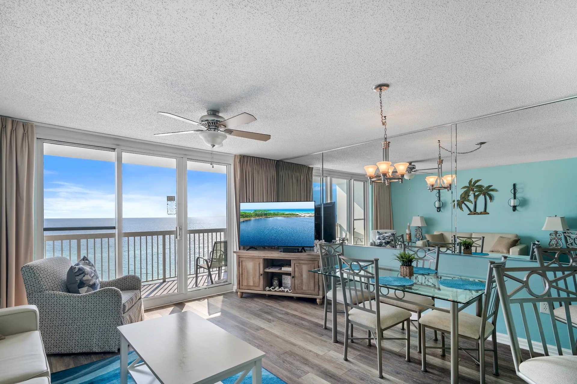 Unit 1006 living and dining area with a wide Gulf backdrop