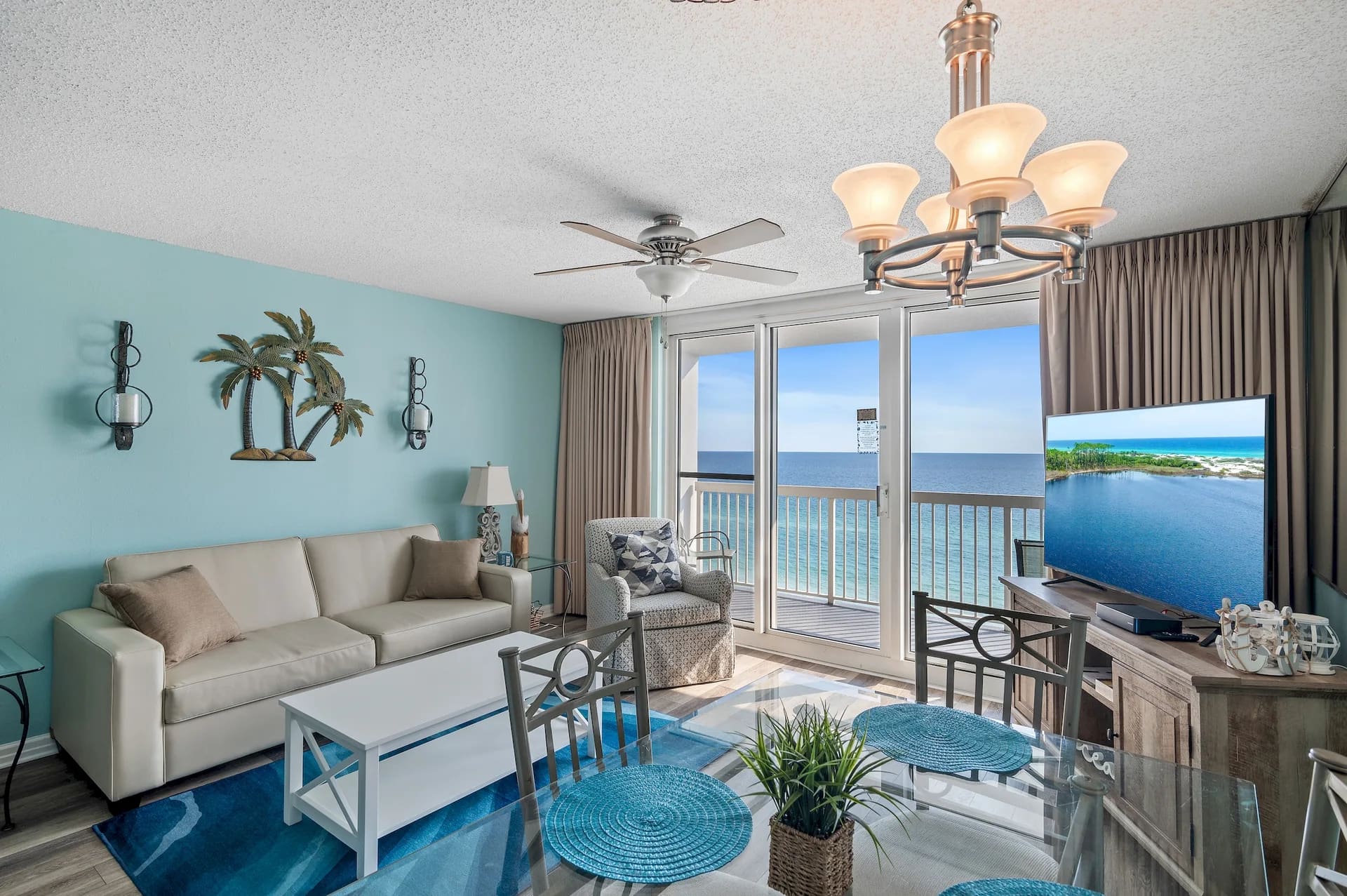Bright Unit 1006 living room with balcony doors and panoramic Gulf view