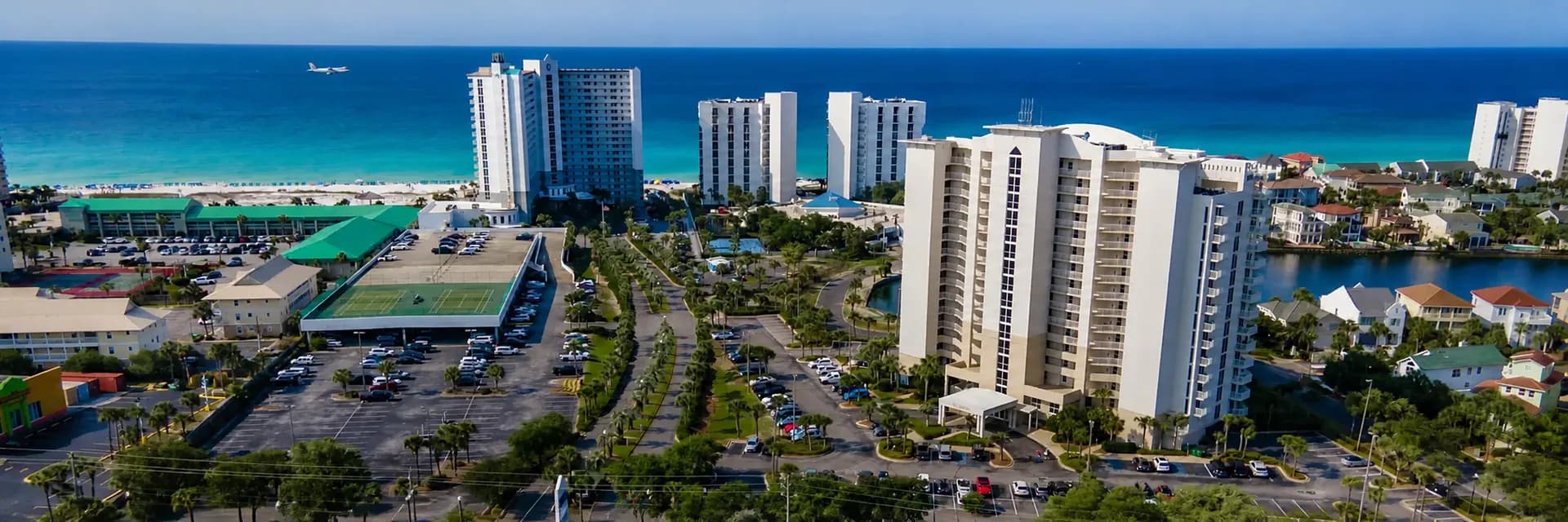 Aerial view of Destin's coastline and emerald Gulf water